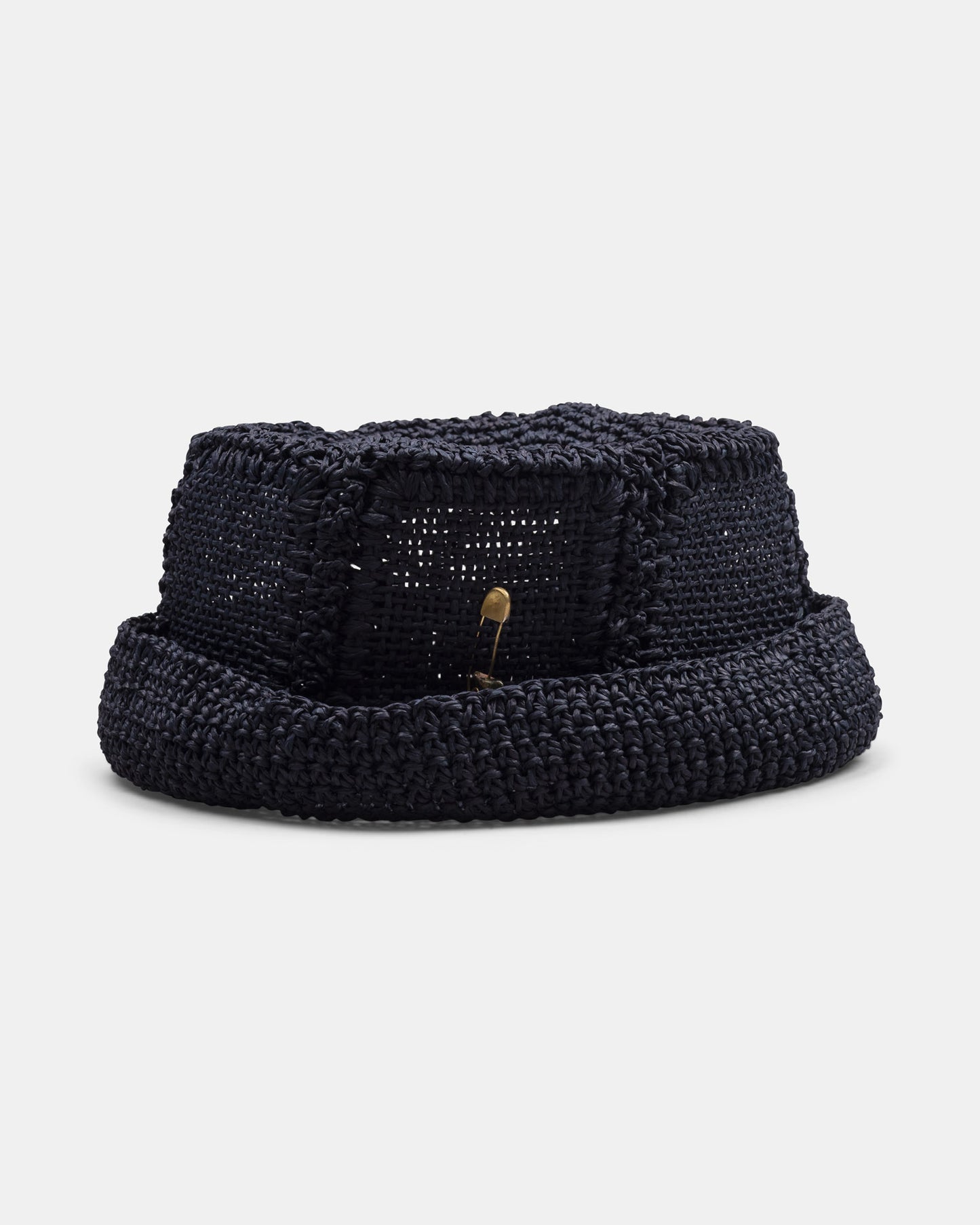 Handmade black woven straw hat with wide brim and open weave details on white background