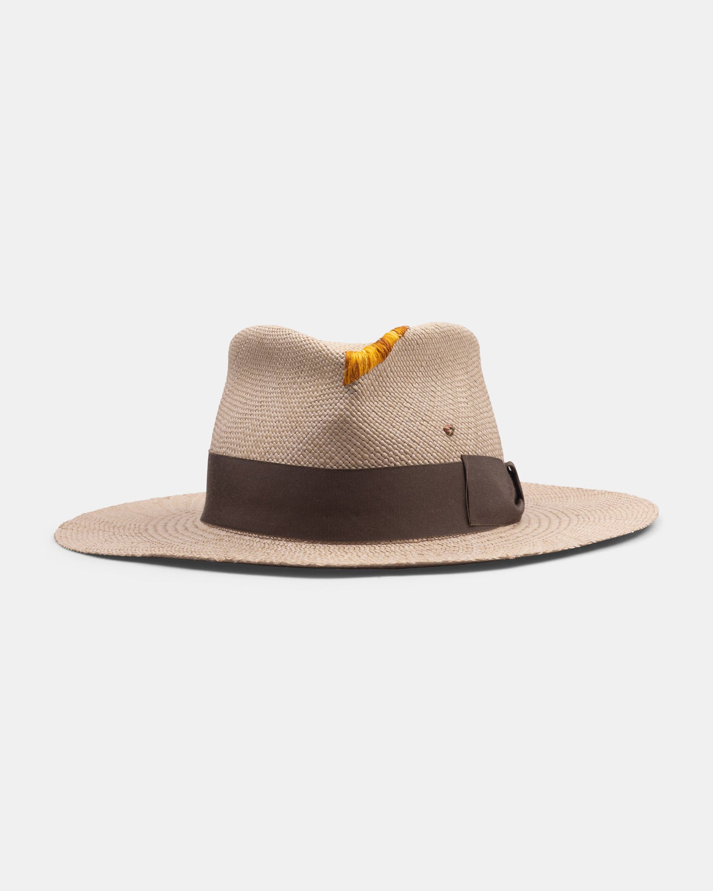 Handmade Italian straw hat with wide brim, brown band, and yellow feather accent.