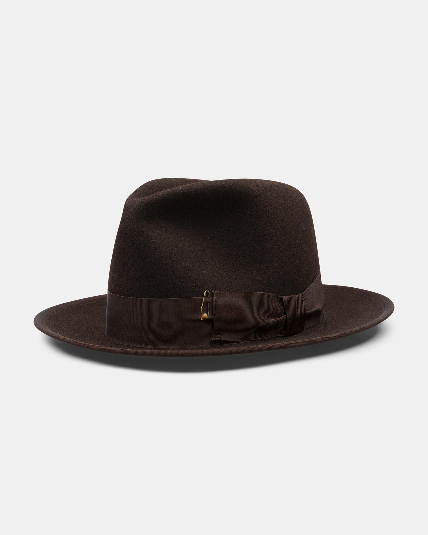 Classic dark brown felt fedora hat with grosgrain ribbon and pin detail on a white background