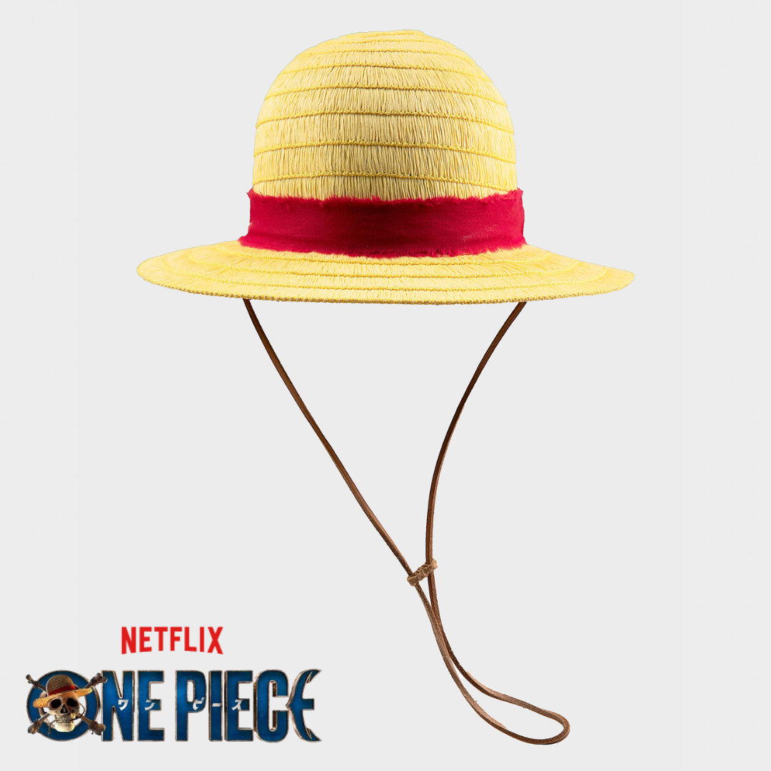 Yellow straw hat with red band and chin strap, inspired by One Piece, on white background.