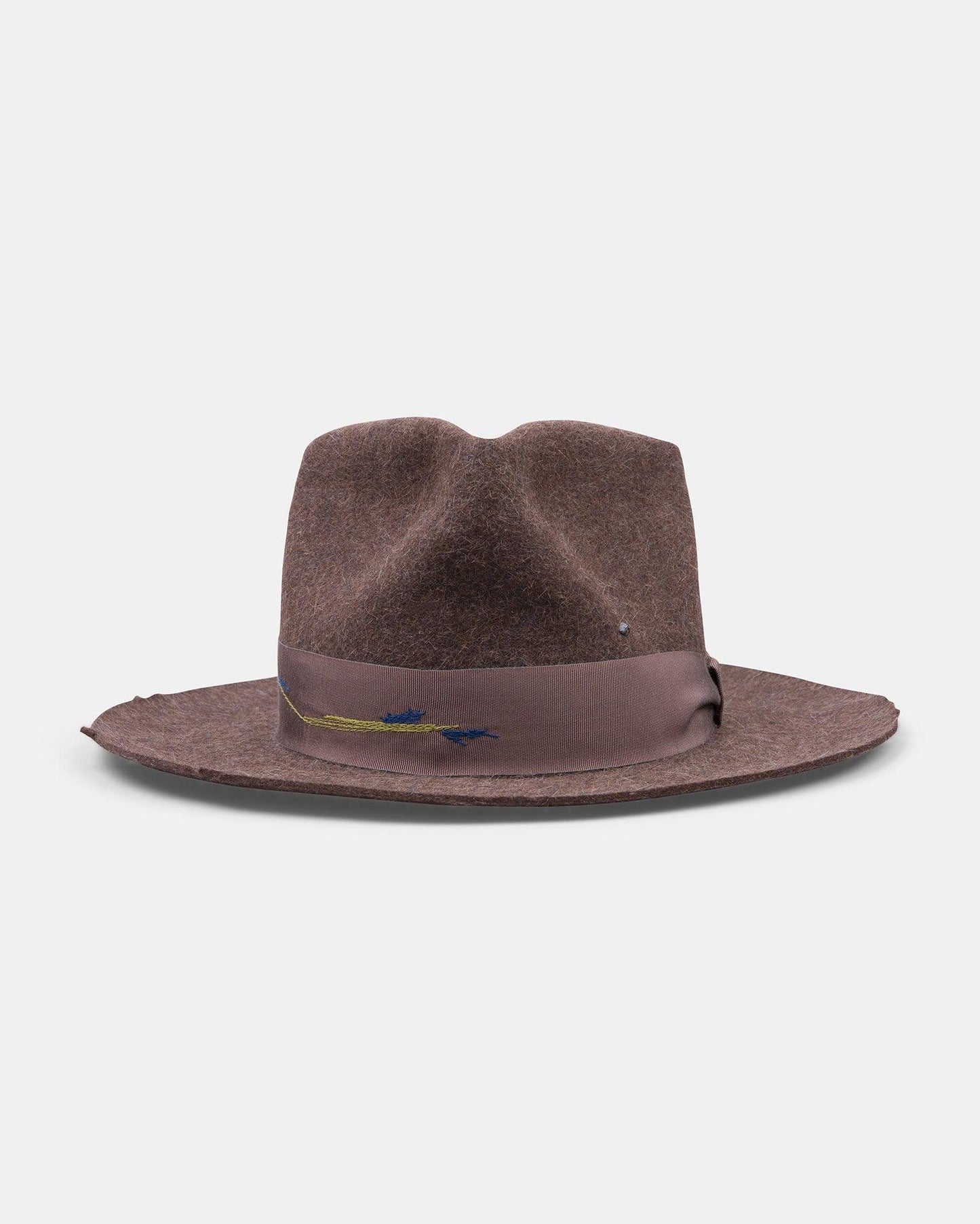 Brown felt fedora hat with wide brim and decorative ribbon on white background