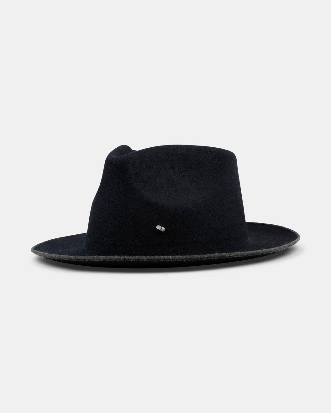 Handmade navy felt fedora hat with a wide brim and metal accent, displayed on white background