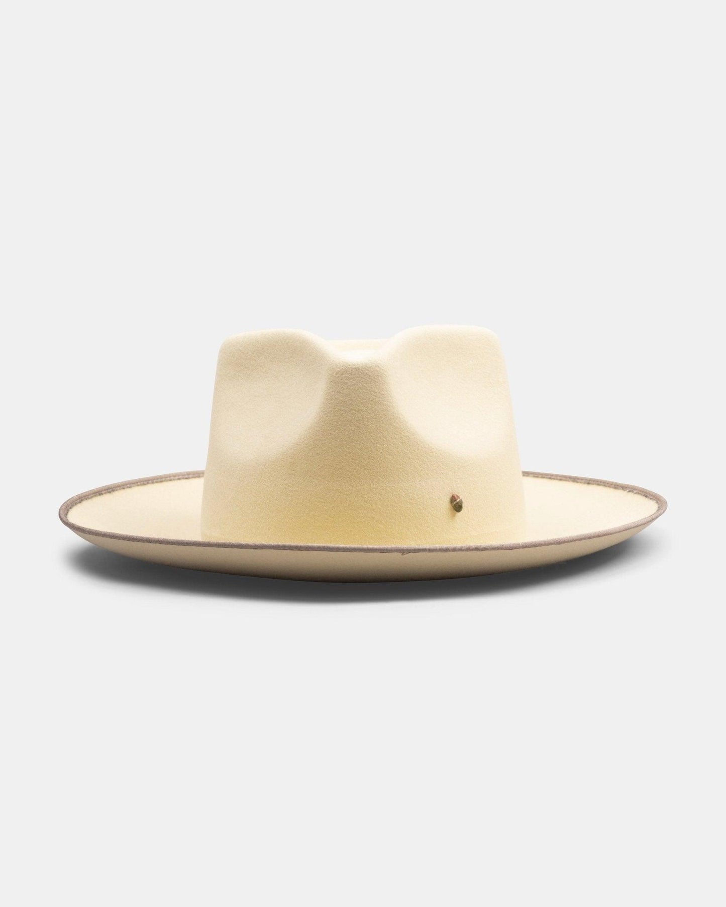 Handmade Italian felt hat in old white with wide brim and classic crown, neutral background