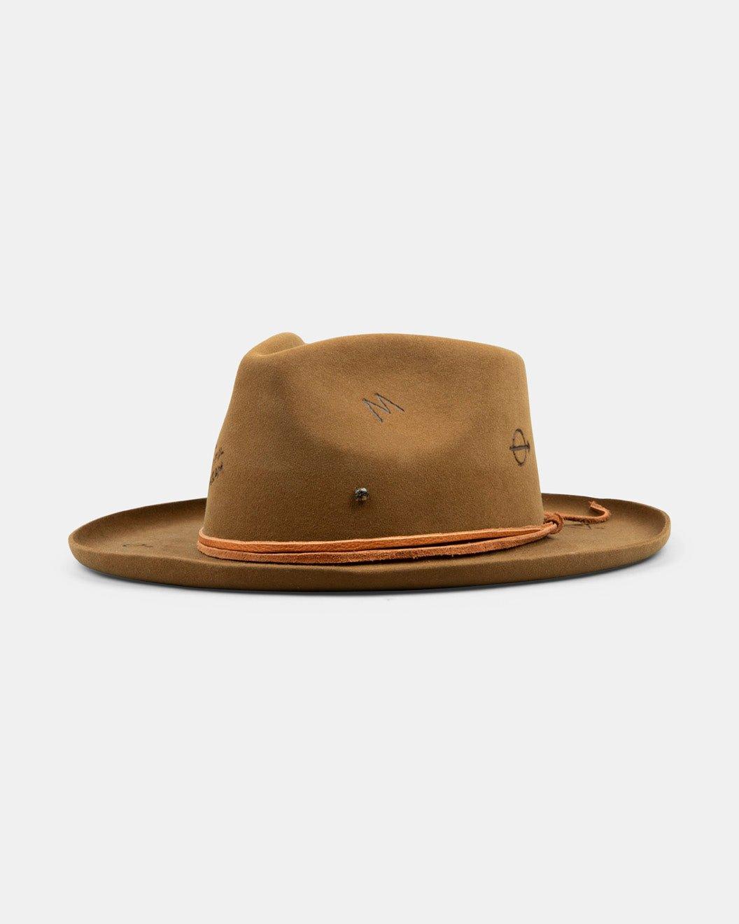 Brown felt fedora hat with wide brim, decorative stitching, and leather cord band, on white background.