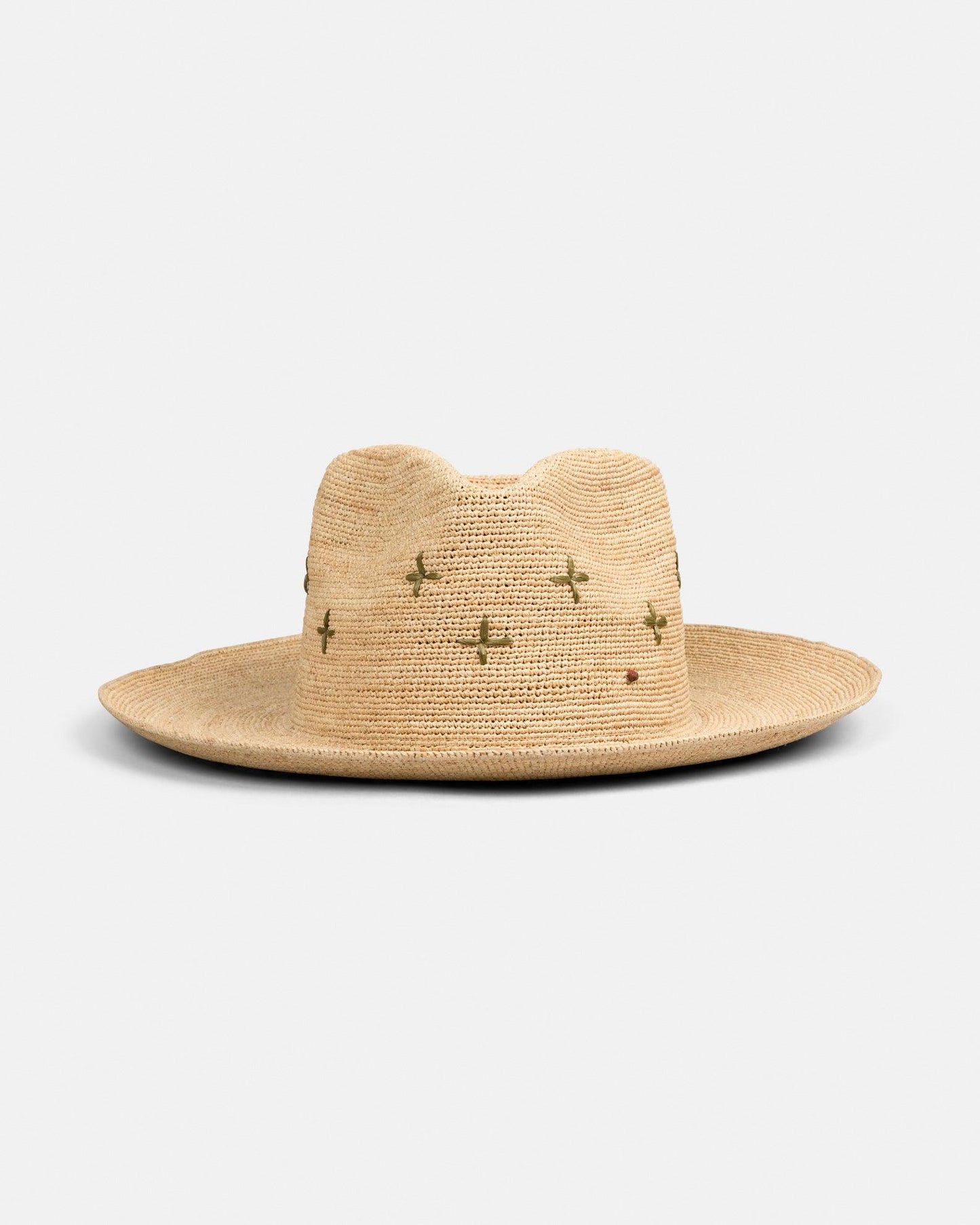 Natural straw wide brim hat with green embroidered cactus details on a white background