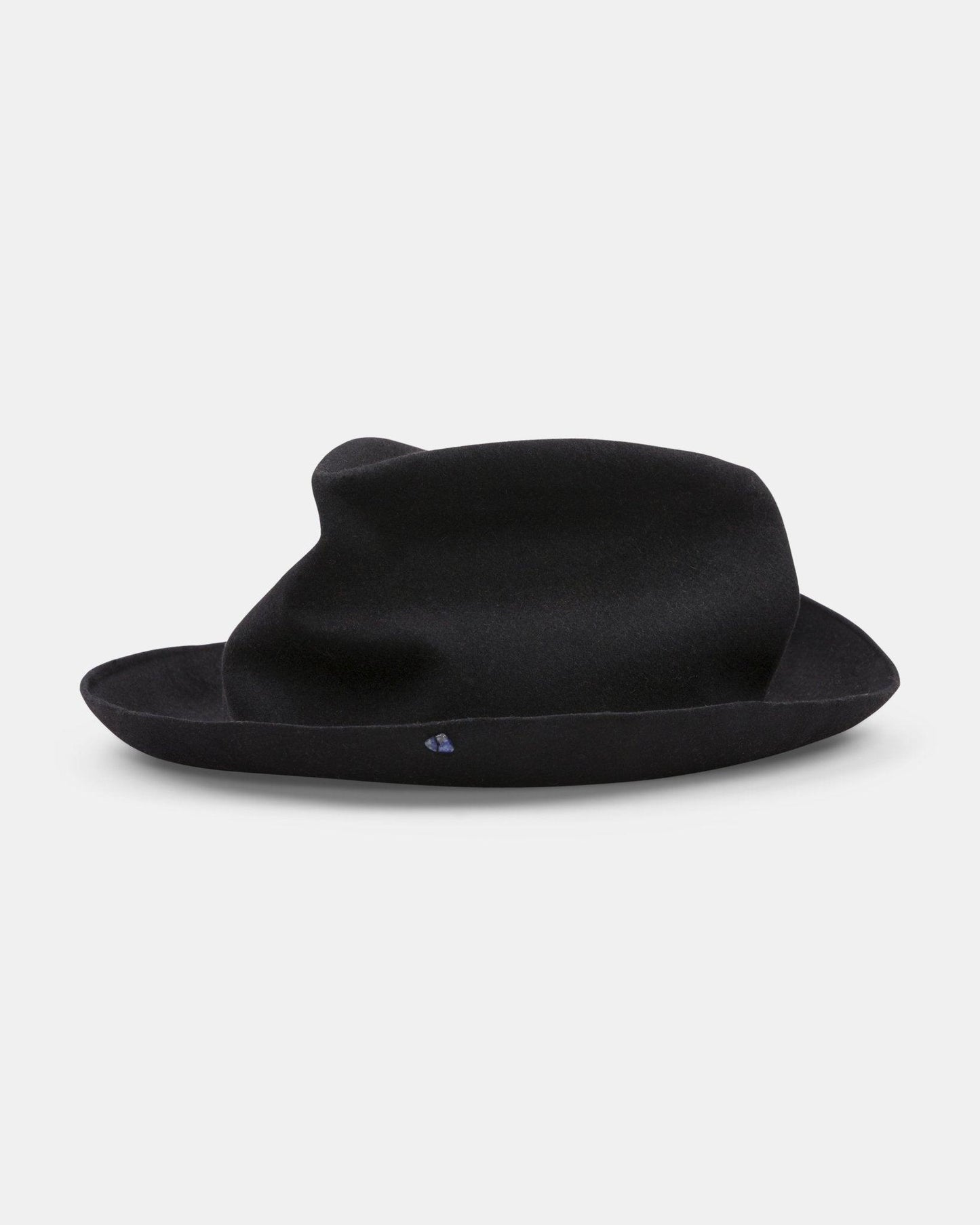 Black handmade felt hat with a wide, slightly floppy brim on a white background