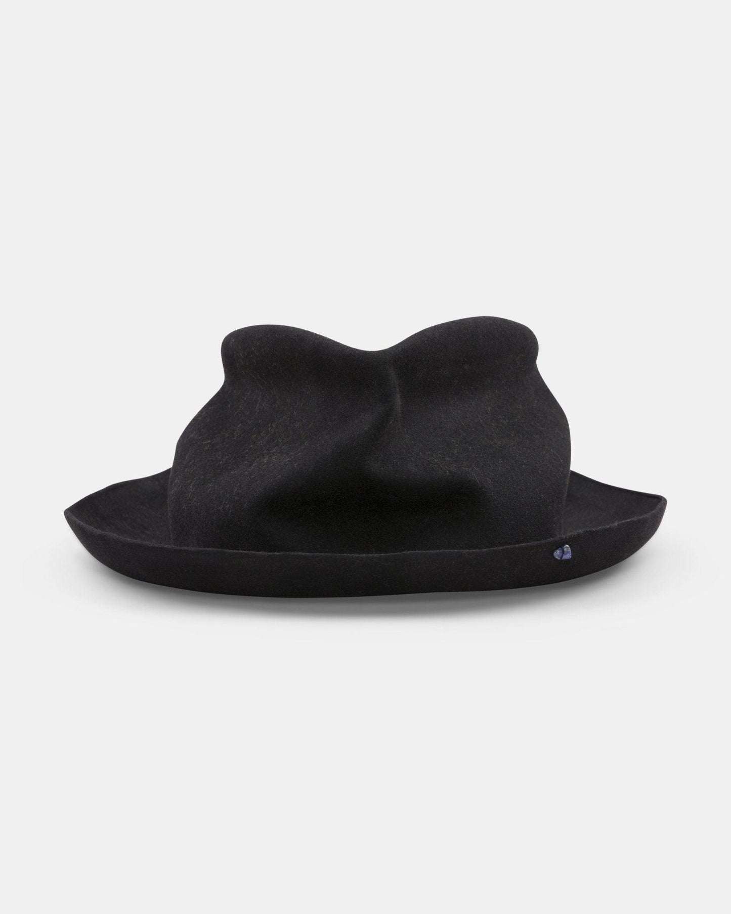 Black felt handmade Italian hat with soft crown and rolled brim on white background
