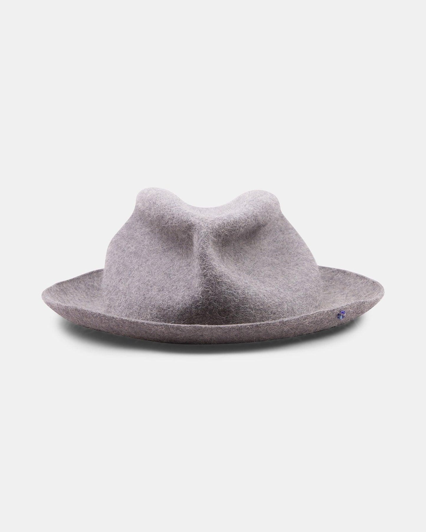 Light grey handmade felt hat with a unique dented crown and wide brim on a white background.