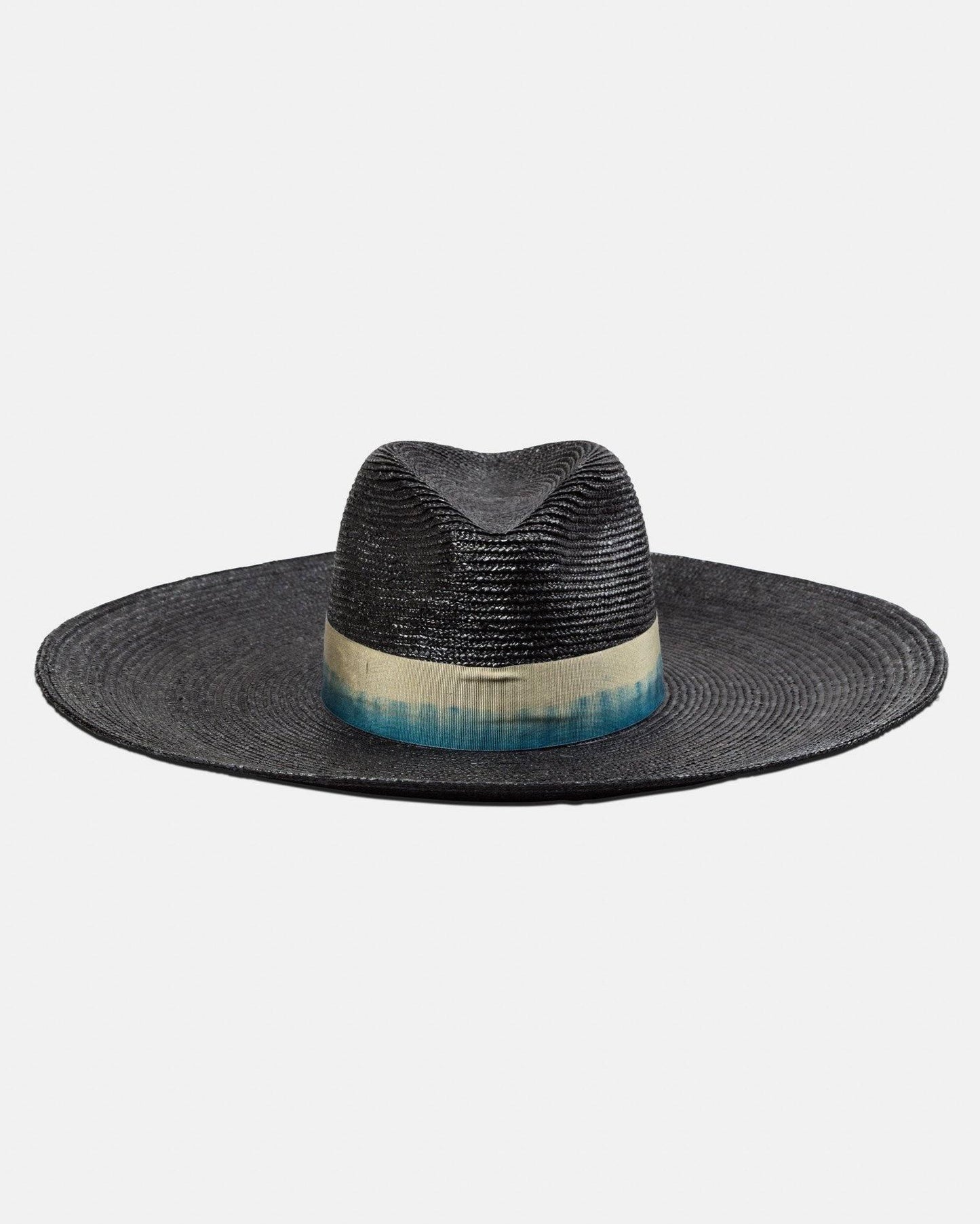 Wide-brim black straw hat with gradient blue and beige ribbon on white background